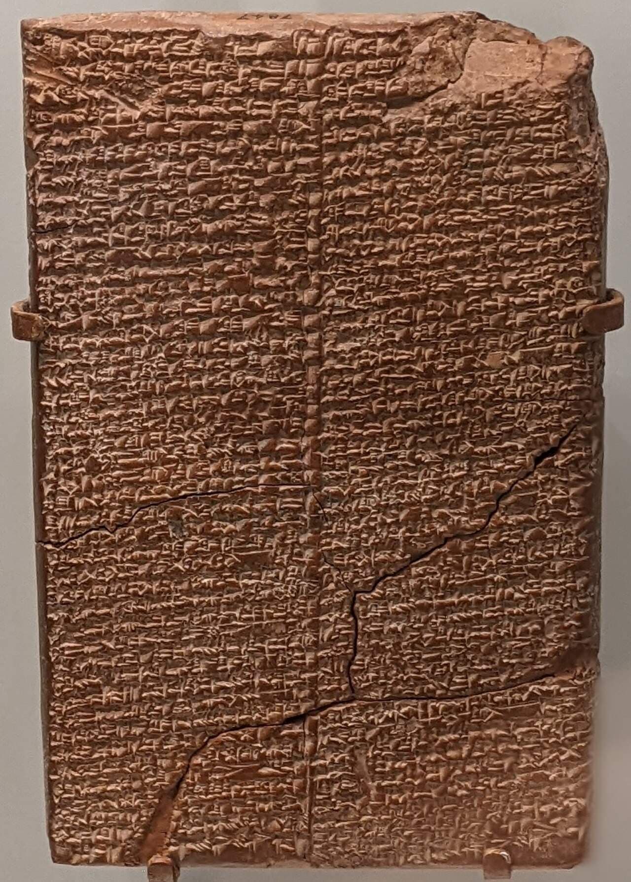 Ancient clay tablet covered in two columns of cuneiform script