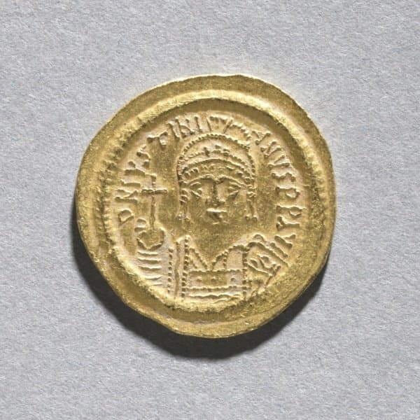 Gold coin showing a crowned, frontal bust of an emperor holding a cross-topped orb